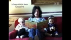 Michael Jackson reading a book to Prince and Paris