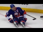 Tavares helped off ice after getting caught up in net