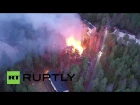 Финляндия - Пожар в лагере для беженцев.Finland: Drone captures planned refugee centre in flames after suspected arson attack