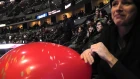 Balloon Mistress inflating a balloon at a Colorado Avalanche hockey game.MTS